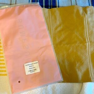 The support waist trainer by bumpsuit in beige